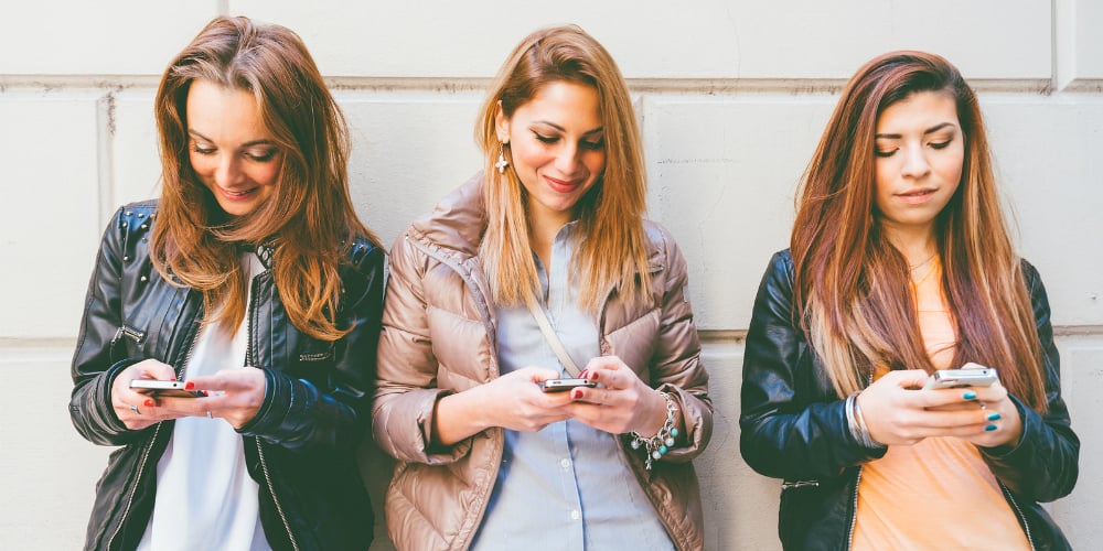 bigstock-Women-Typing-On-Mobile-Phones-75509608