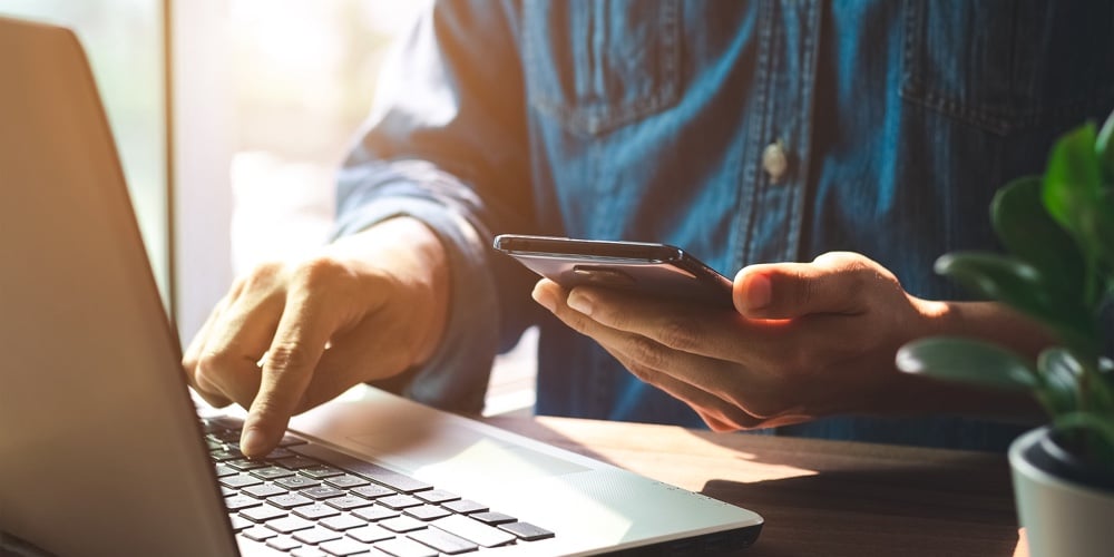 bigstock-Work-Using-Mobile-Phone-Typing-412434748