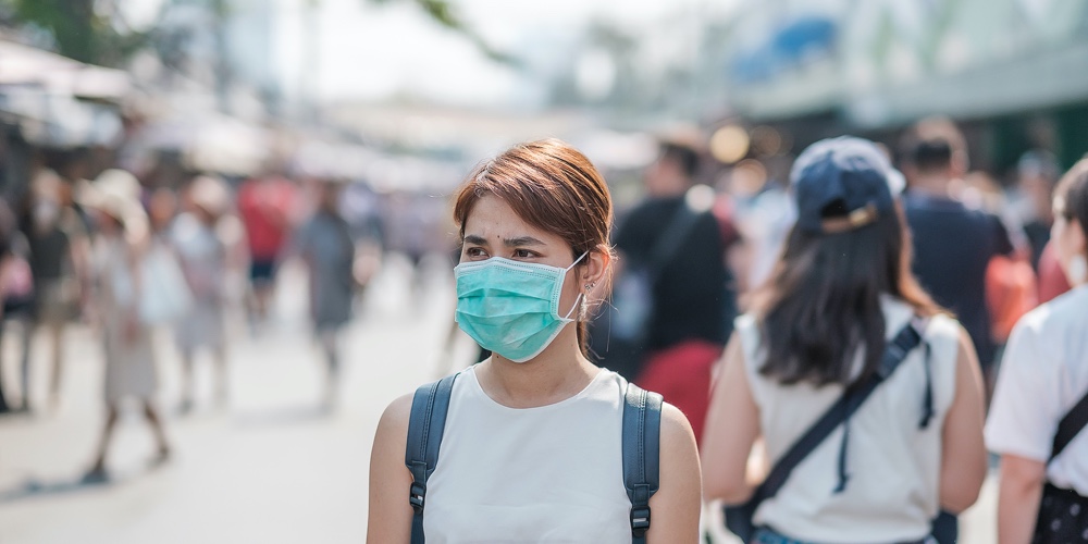 Young Asian Woman Wearing Protection Mask Against Novel Coronavirus (2019-ncov) Or Wuhan Coronavirus