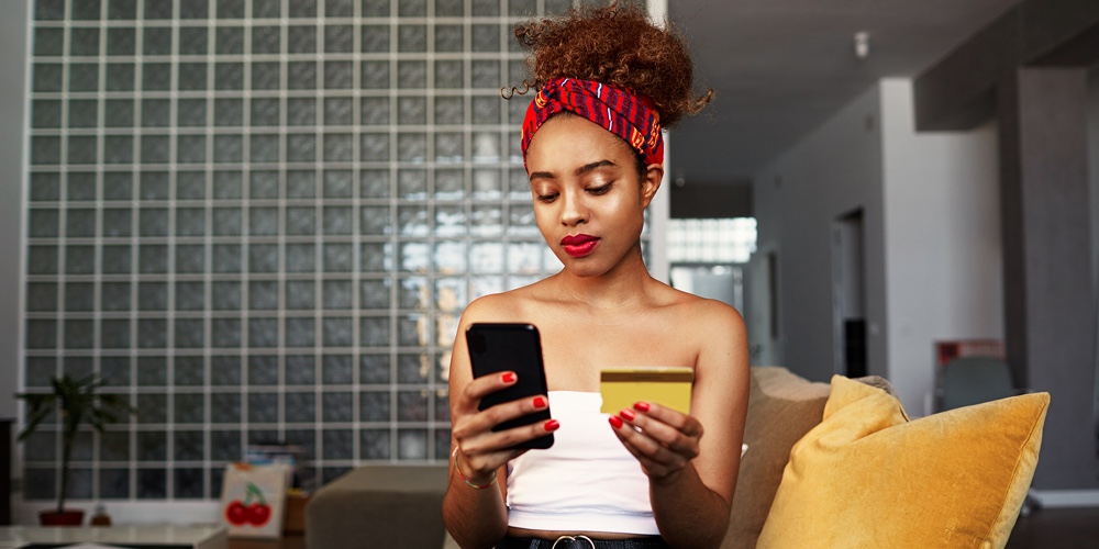 CEO Connect November pic|Young Attractive Black African Female Holding Hands Credit Card And Mobile Phone Hands. Technology