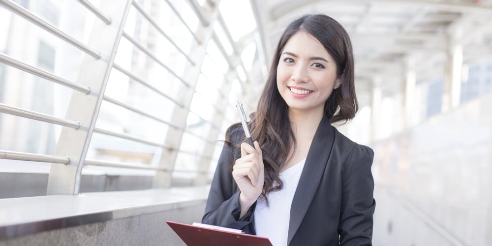 Young Beautiful Business Woman Standing In City With Success Feeling For Work. Young Business Woman