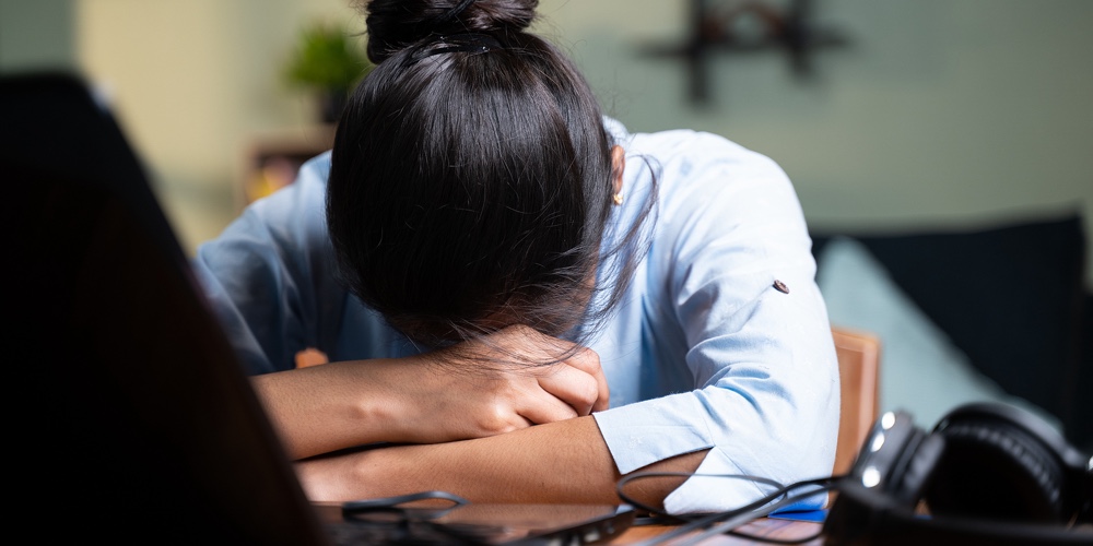 Young Business Woman Sleeping By Closing Laptop While Working