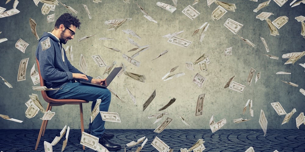 bigstock-Young-Man-Using-A-Laptop-Build-228480655