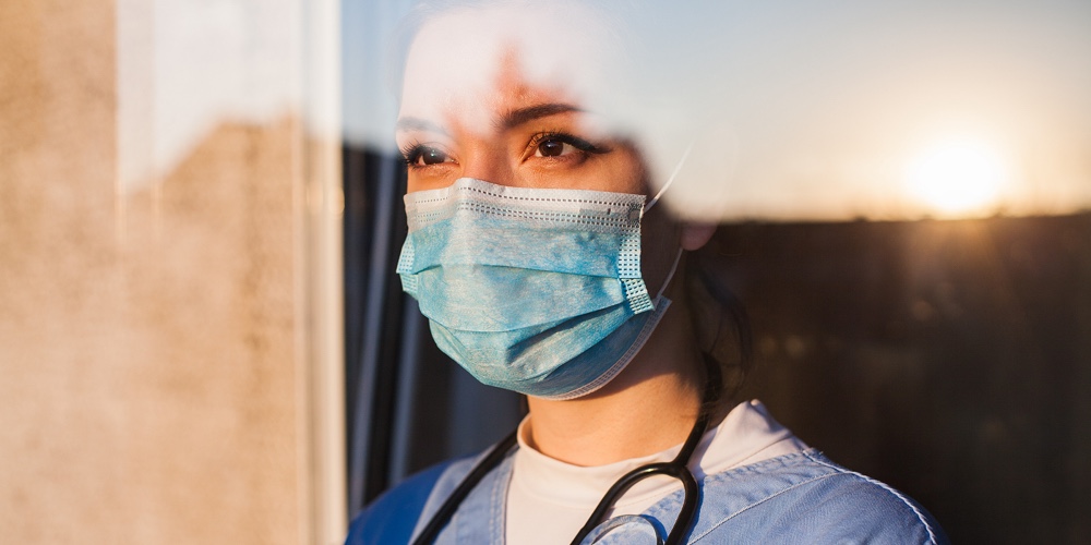 Young Sad Female Caucasian Uk Us Nhs Ems Doctor Carer Looking Through Icu Window