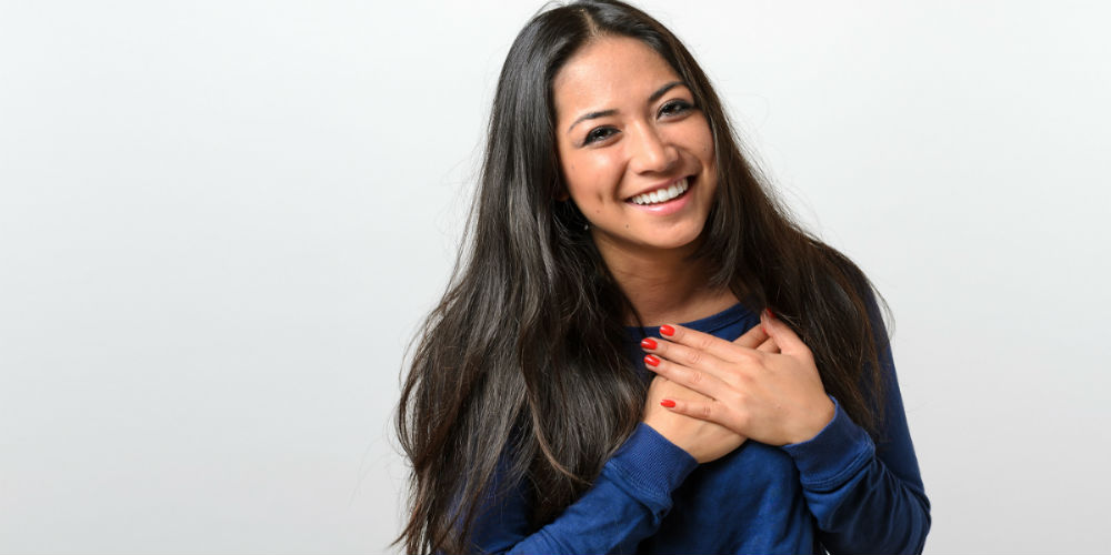 bigstock-Young-Woman-Showing-Her-Heartf-114669992