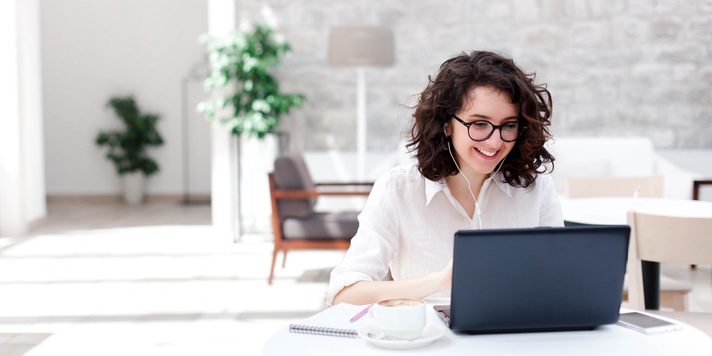 Young Woman Using Laptop For Webinar