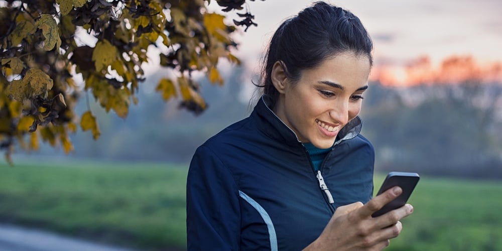 bigstock-Young-athlete-looking-at-phone-206291722