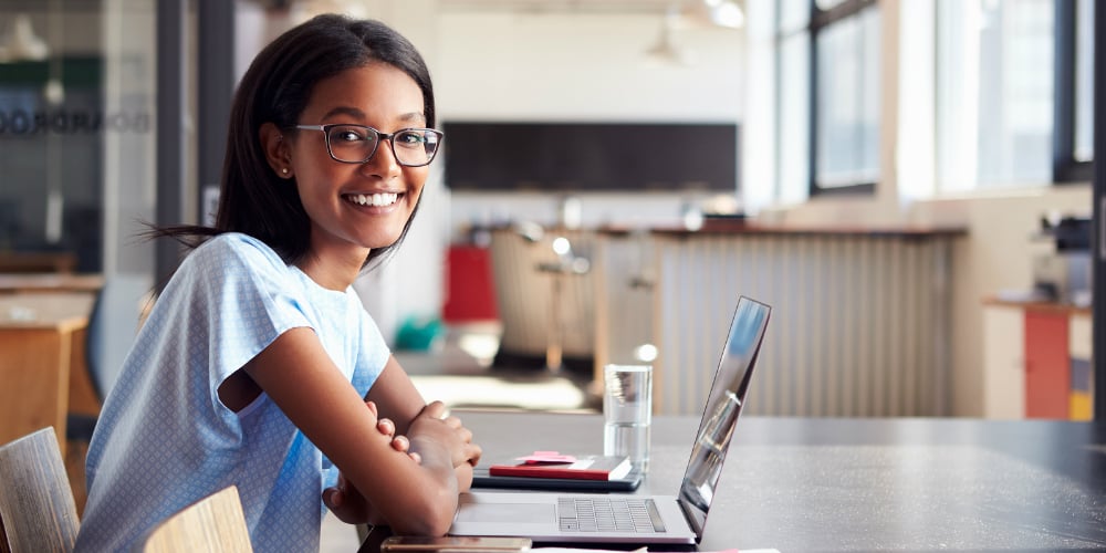 bigstock-Young-black-woman-in-office-wi-183824719