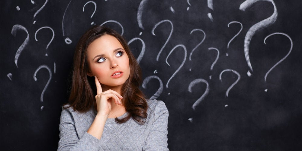 bigstock-Young-girl-with-question-mark-119728214