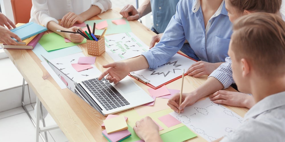 bigstock-Young-team-working-with-market-189083755