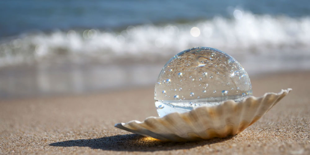 bigstock-crystal-ball-as-the-pearl-77684180