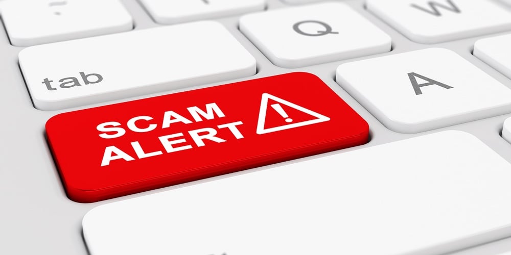 3d Render Of A Keyboard With A Red Key And The Message Scam Alert
