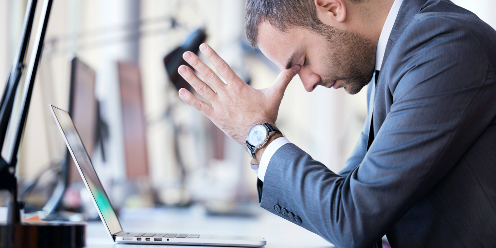 bigstock-frustrated-young-business-man-80749853