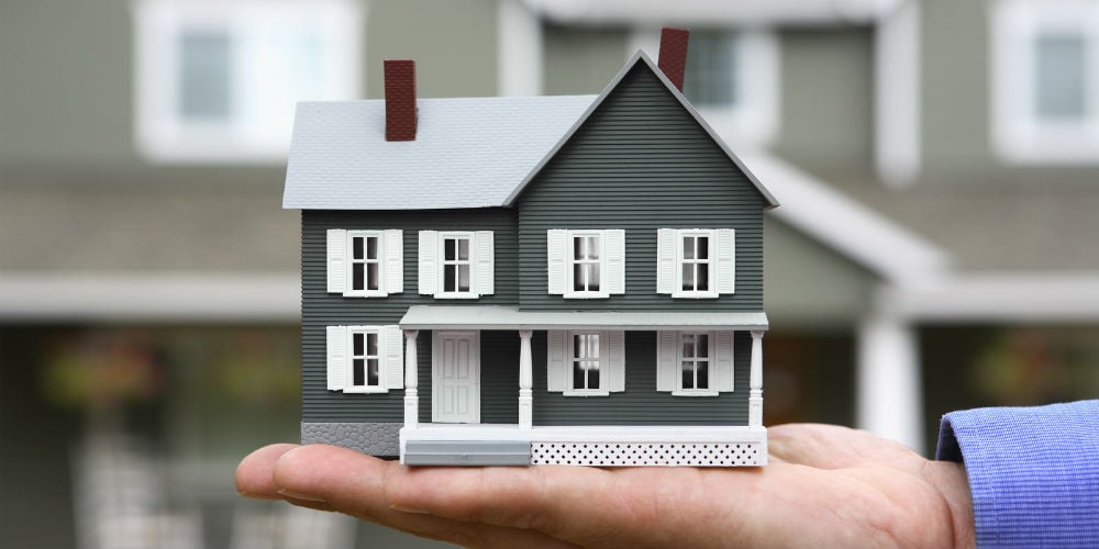 bigstock-miniature-house-in-man-s-hand-61264220