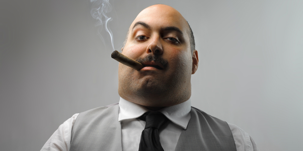 bigstock-portrait-of-man-smoking-cigar-12156542
