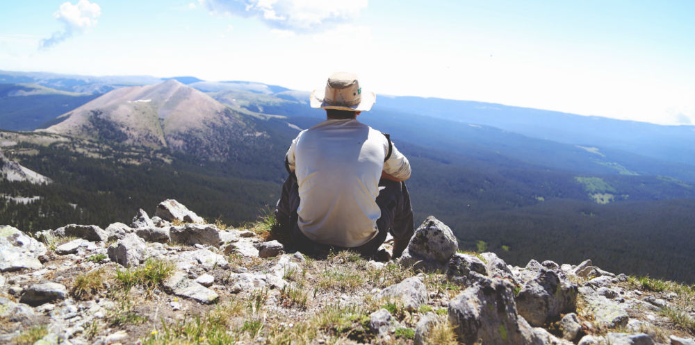 bigstock-Businessman-in-hat-on-the-peak-119932475|perspective