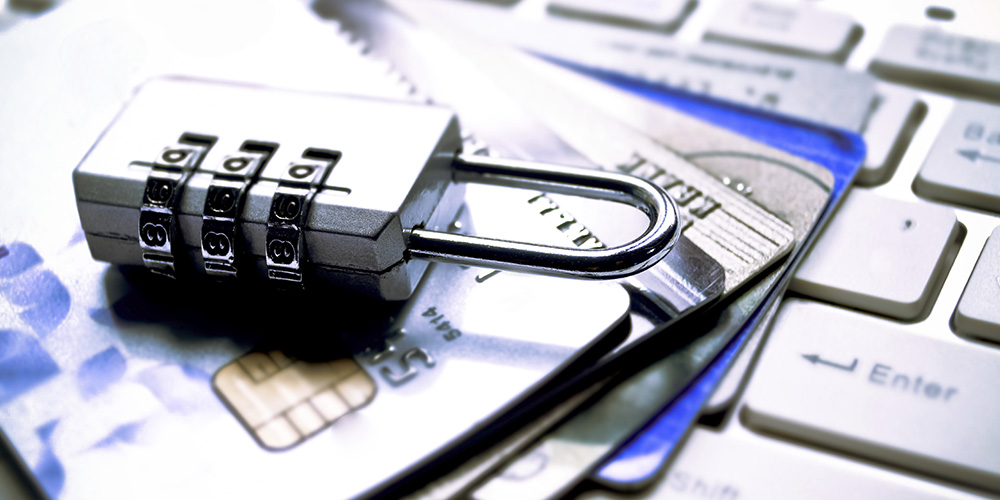 bigstock-Businessman-with-magnifying-gl-95873852|financial-security-1000×500