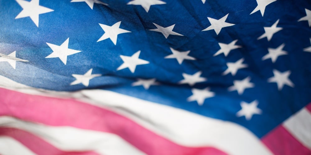 Tombstones and United States Natioanal flags during Memorial Day – Circa Washington DC USA
