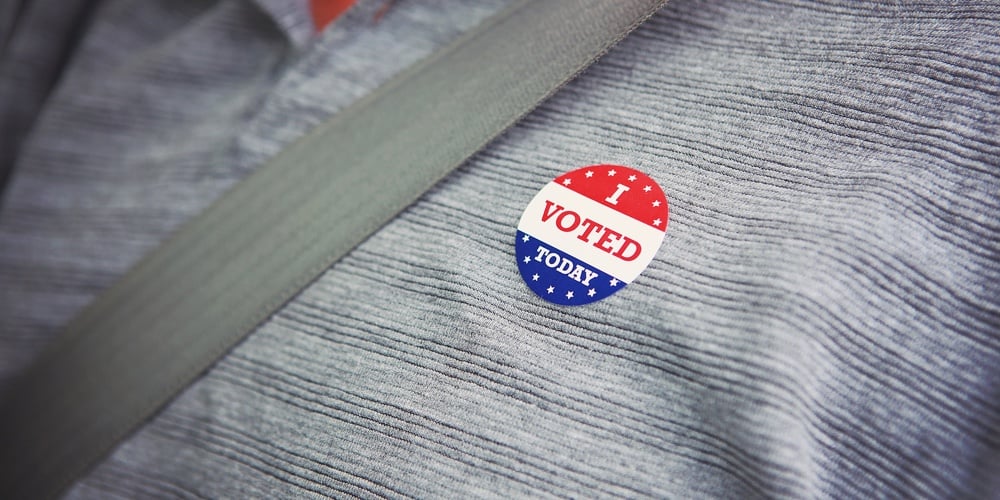 bigstock-I-voted-today-sticker-on-a-man-253910338