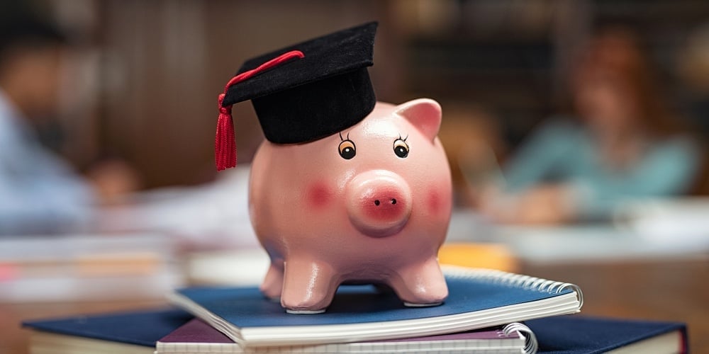 bigstock-Piggy-bank-wearing-mortar-boar-357814247