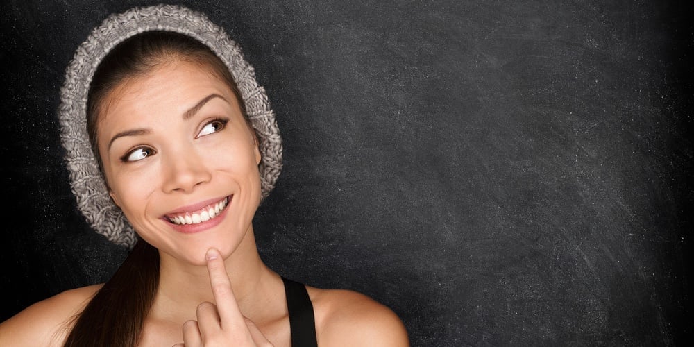 bigstock-Thinking-woman-by-blackboard-49050929