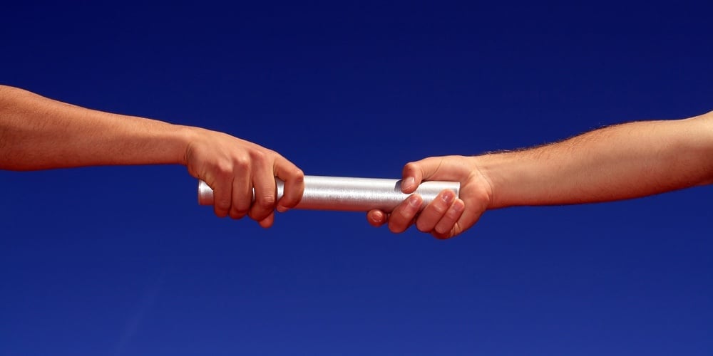 bigstock-hands-passing-the-batton-again-28460165