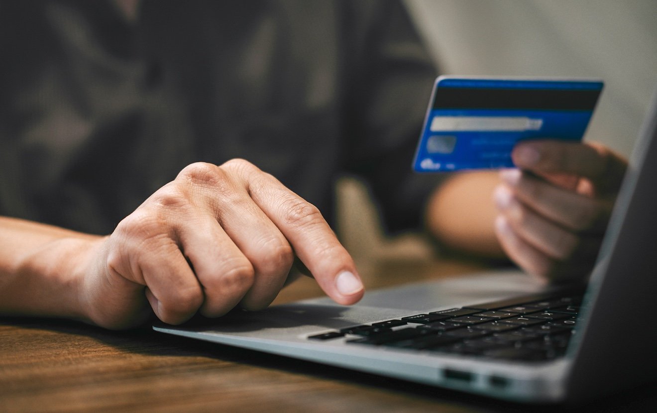 Businessman Holding Credit Card And Typing On Laptop For Online Shopping And Payment Makes A Purchas