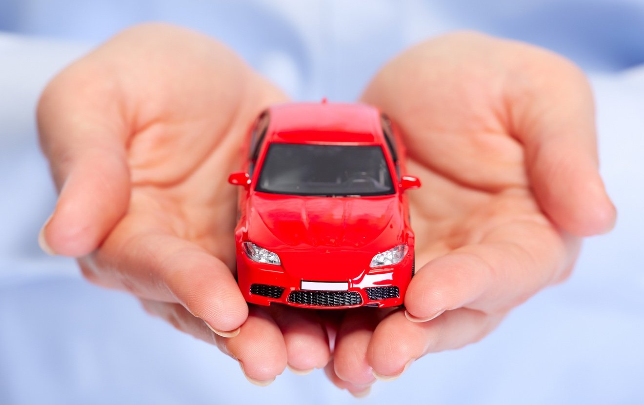 Hand with car. Auto dealership and rental concept background.