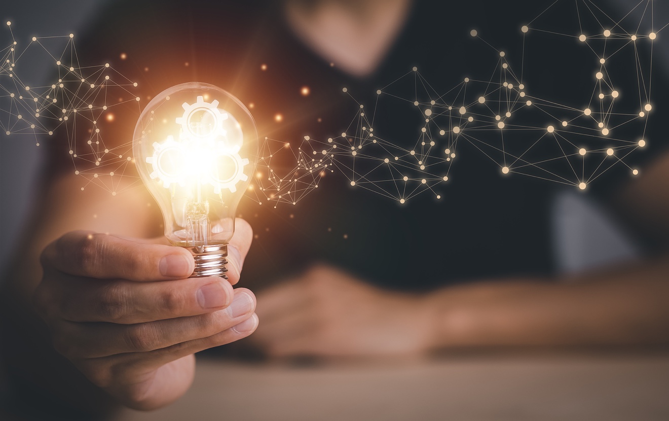 Innovative Technology In Science And Communication Concepts, And Creativity With Glowing Light Bulbs