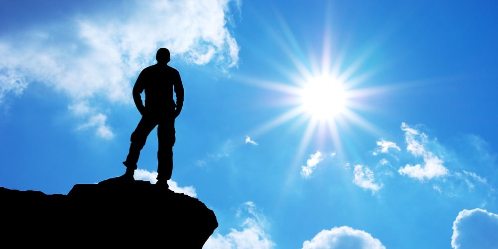bigstock-Man-on-top-of-mountain-Concep-18659273