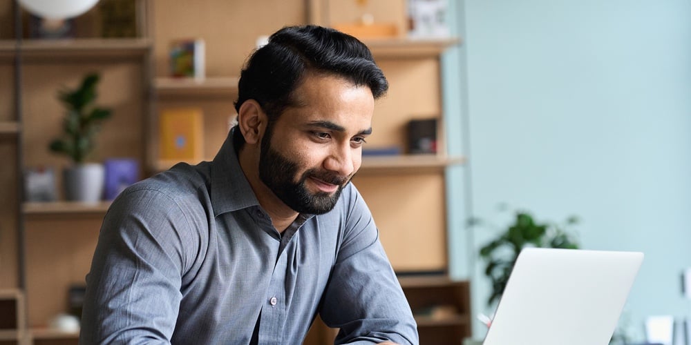 bigstock-Smiling-Indian-Business-Man-Wo-413532824