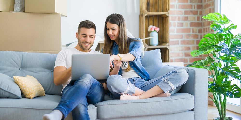 bigstock-Young-couple-moving-to-a-new-h-313357444