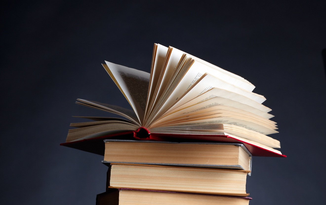 Pile of books on a black background