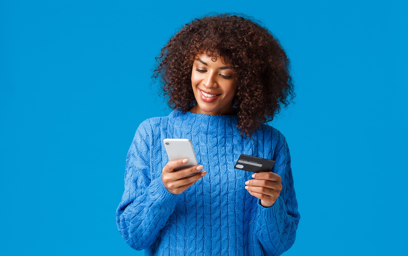 Shopping, Holidays And Presents Concept. Attractive Smiling African-american Woman Paying For Online