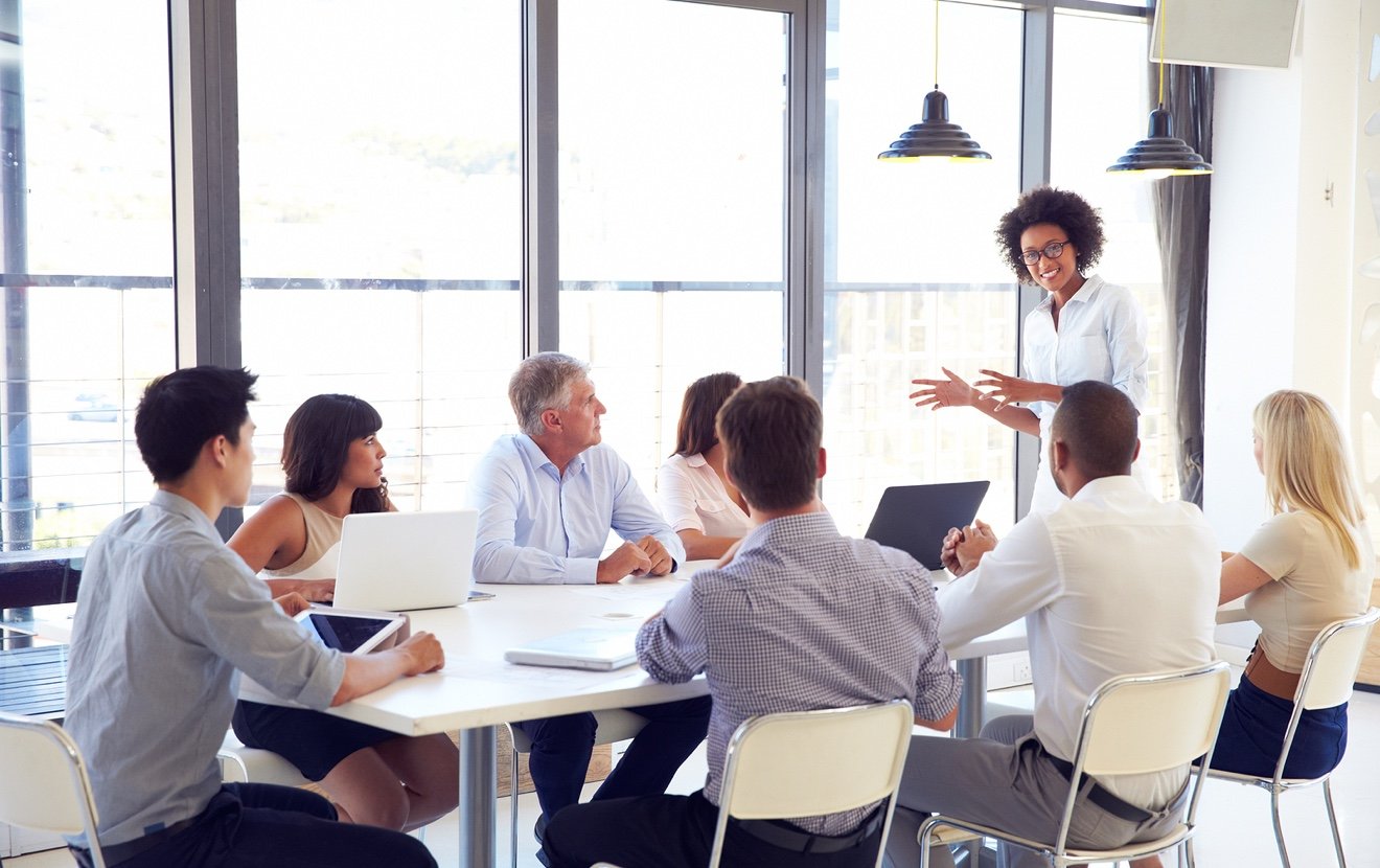 Businesswoman presenting to colleagues at a meeting