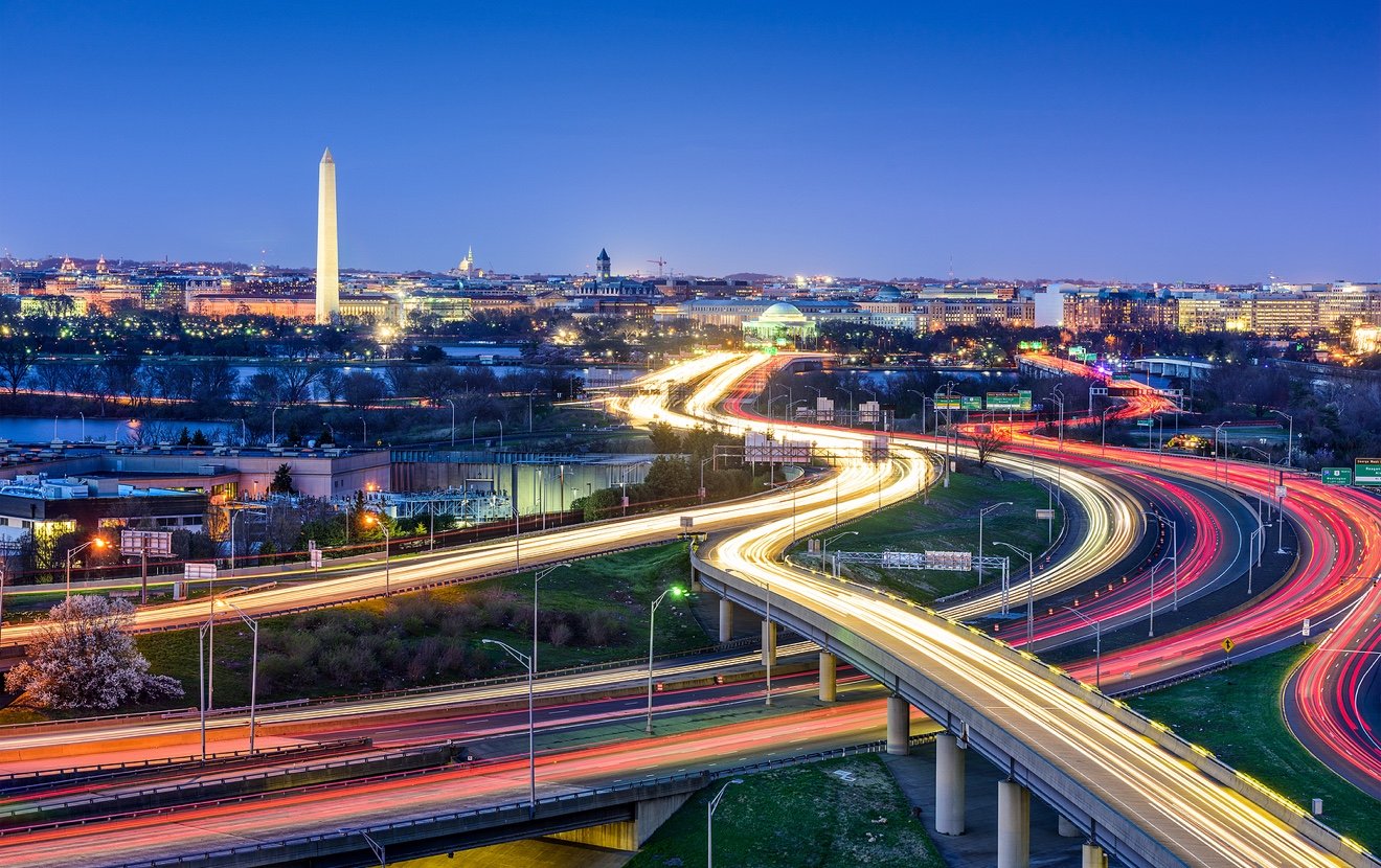 Washington D.C., skyline with highways and monuments.