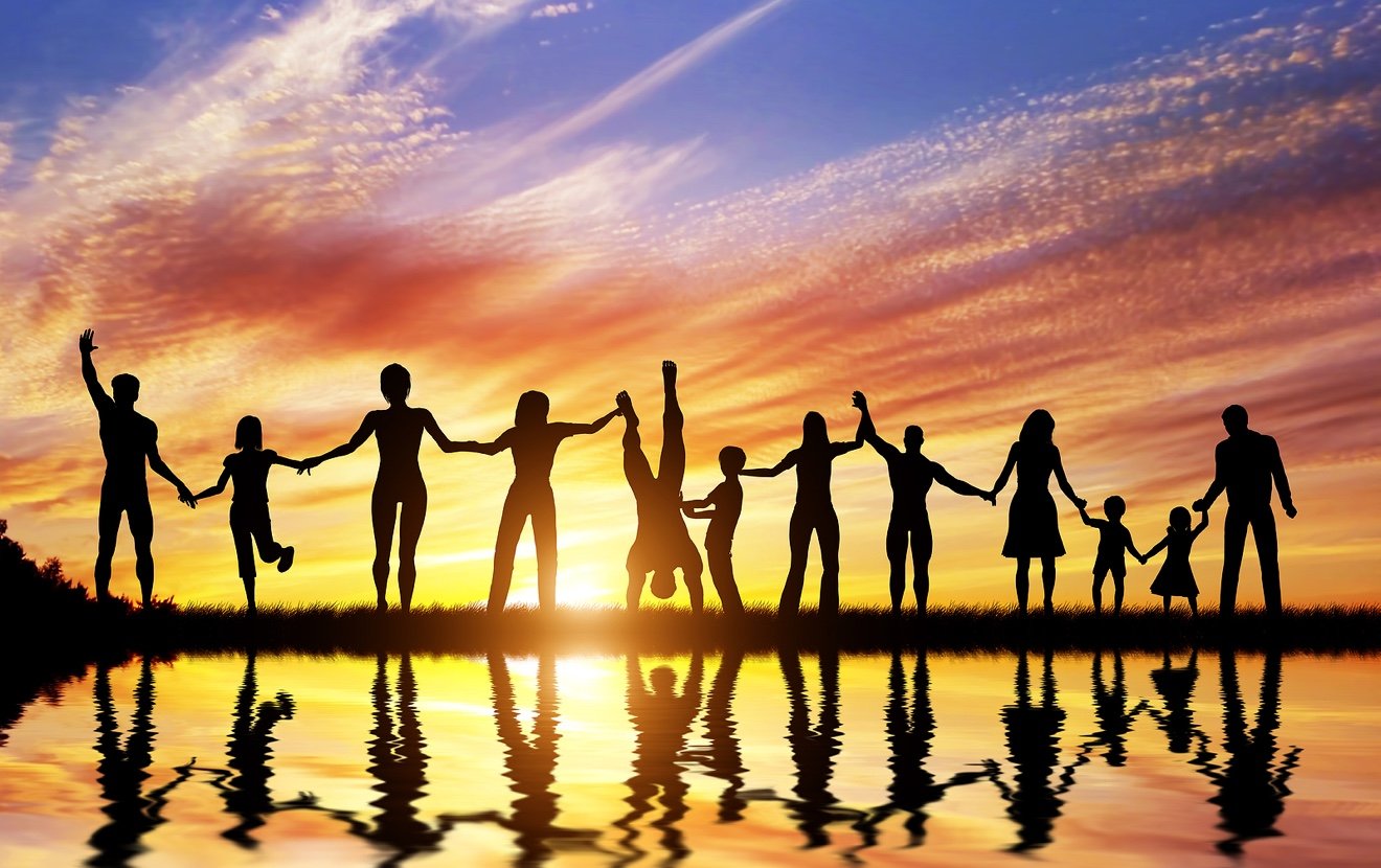 Happy group of diverse people, friends, family, team standing together holding hands and celebrating
