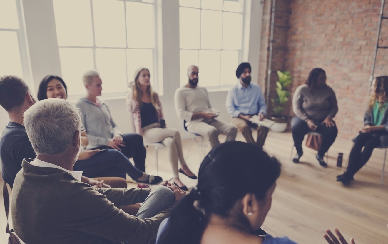 People sitting in a circle counseling