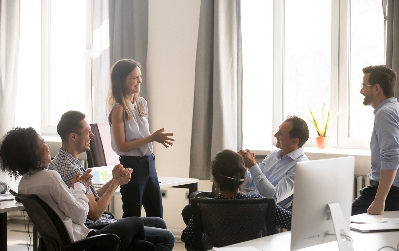 Young Female Coach, Leader Having Fun With Employees, Office Wor