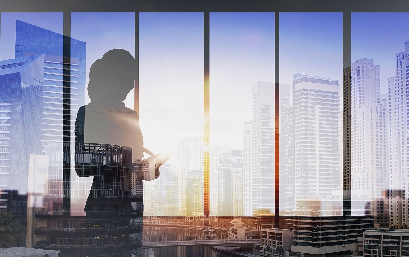 business and people concept – silhouette of woman with tablet pc over office window background over