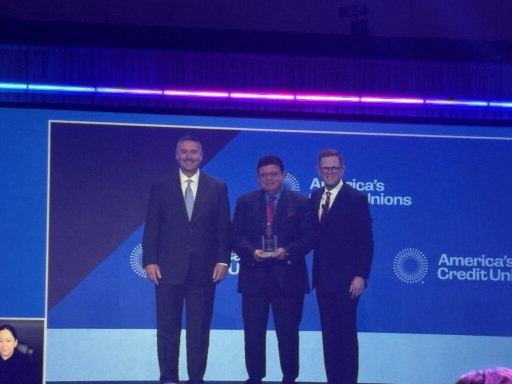Scott Simpson awards Nader Moghaddam with the Greg Inmann Servant Leader Award